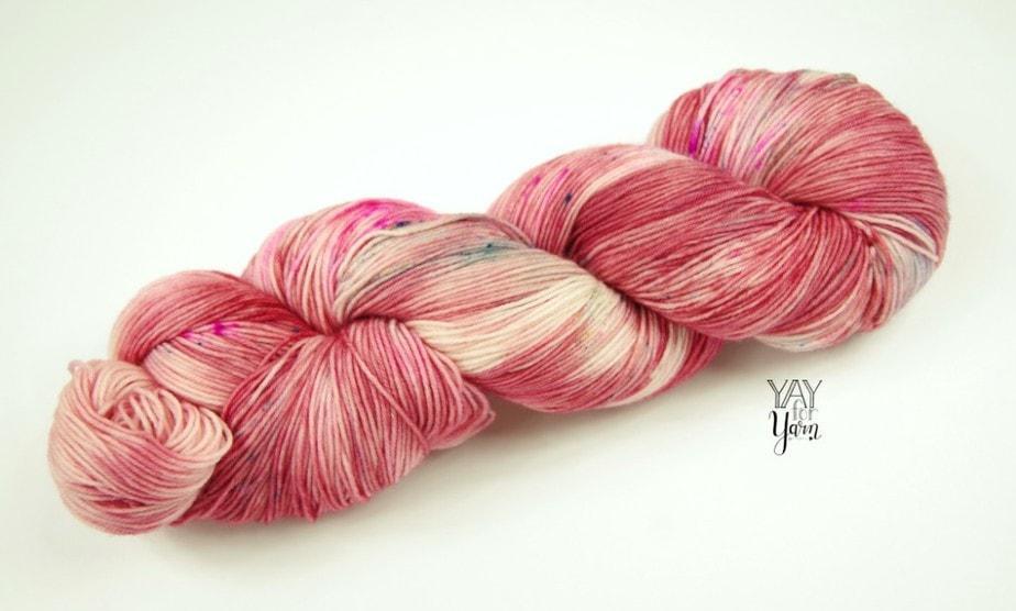 yarn review - one skein of hand dyed wild rose yarn from specktacular yarns