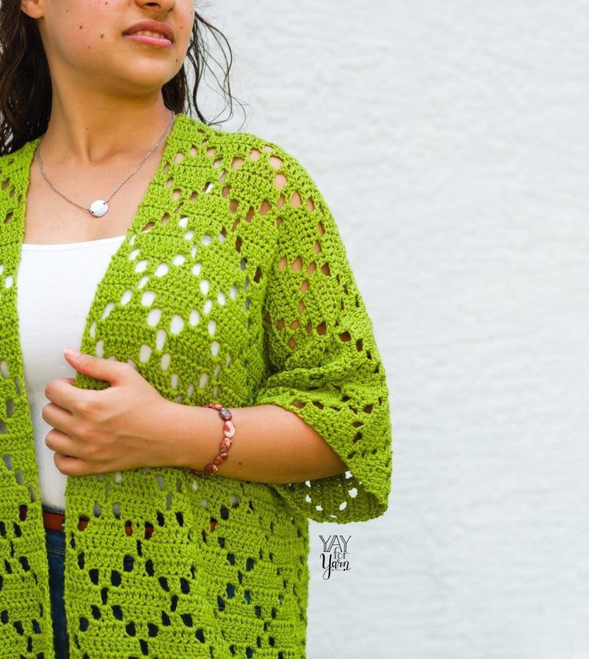 closeup of lime green cardigan with white tank