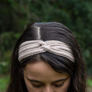 front view of twisted knit headband with eyelets