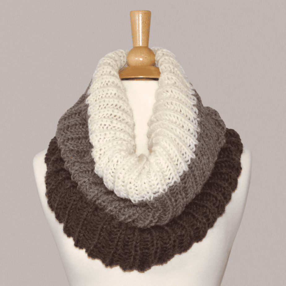A shortcut brioche cowl is displayed on a mannequin stand.