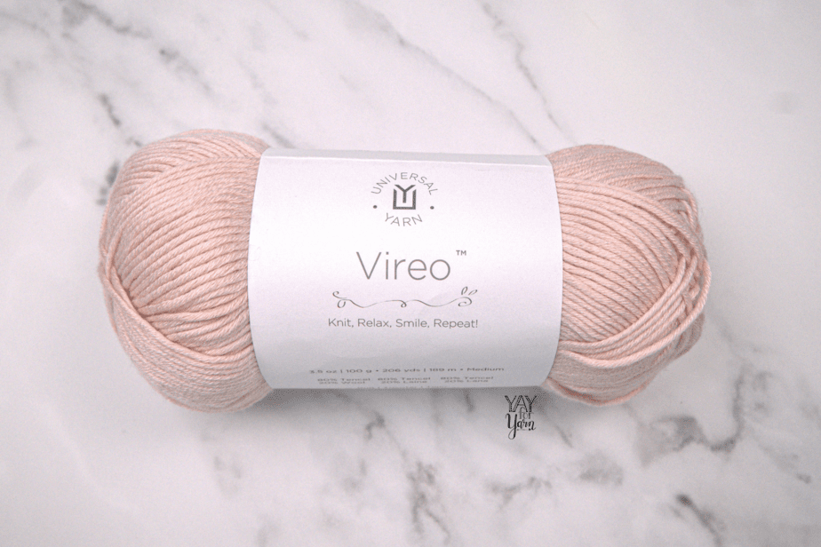 peach vireo yarn with white marble background