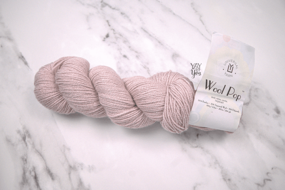 light pink wood pop yarn with white marble background