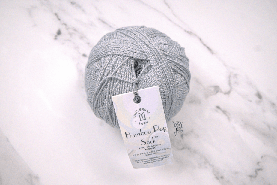 grey bamboo pop sock yarn with white marble background