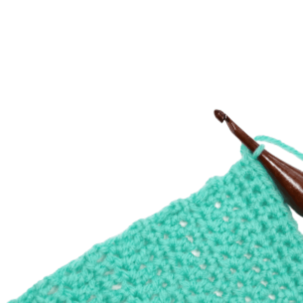 A yarn in teal with a crochet hook in a white background