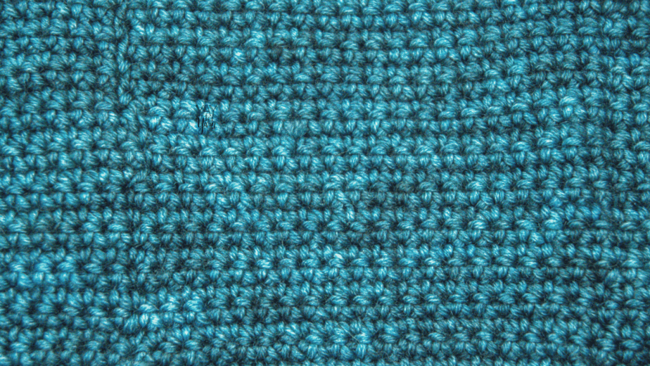 closeup of single crochet fabric in Laurel Hill Variations yarn, Teal